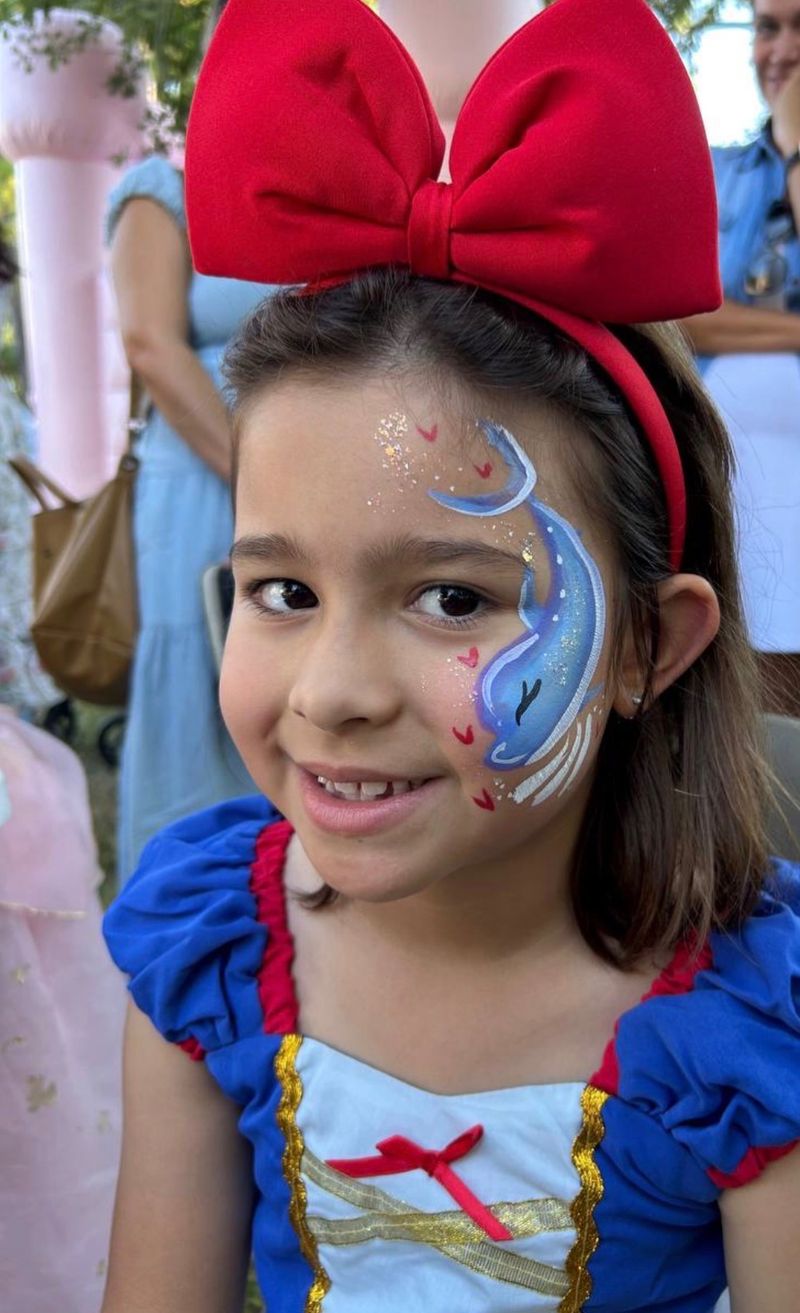 Dolphin and princess face painting at a Texas birthday party